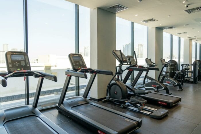 modern fitness gym in dubai with treadmills